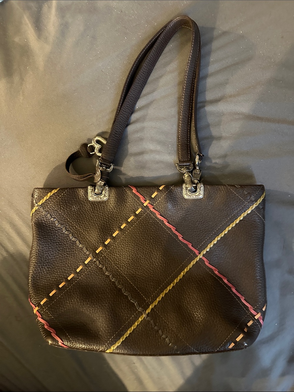 Brighton leather mini bag with stitched diagonal accents.